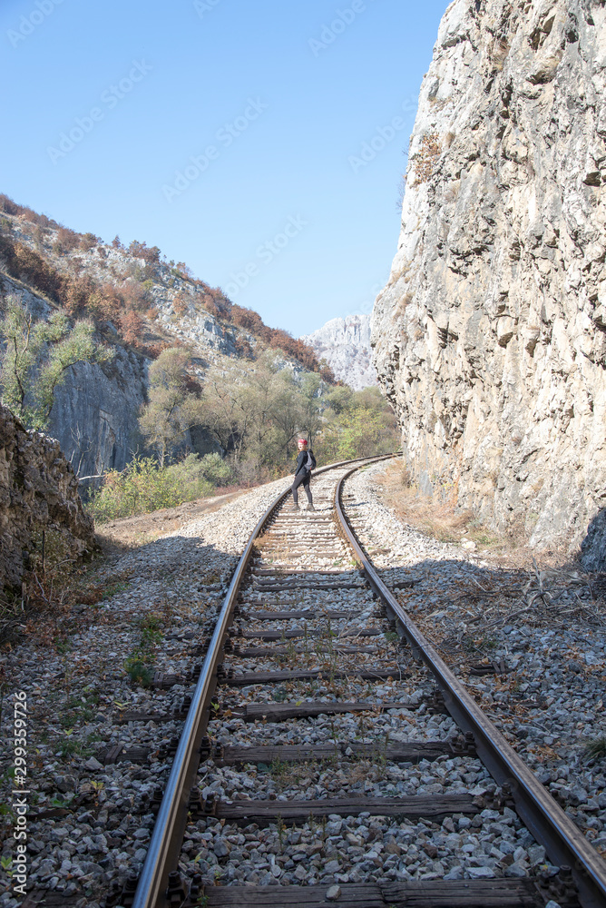 Young woman on the rail 