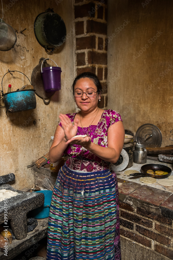 Guatemalan woman makint tortillas in San Juan La Laguna, Lake Atitlan, Guatemala
