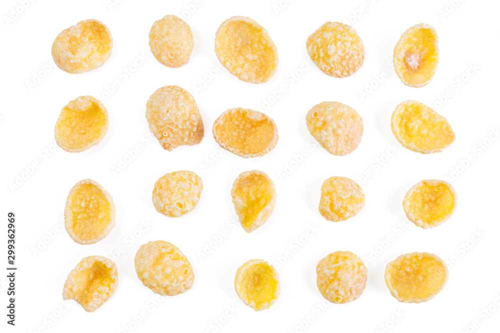 Corn-flakes background and texture. Top view. Traditional dry breakfast cereal. Placer of corn flakes on a white background. Corn-flakes background and texture. Top view. Traditional dry breakfast cereal. Placer of corn flakes on a white background.