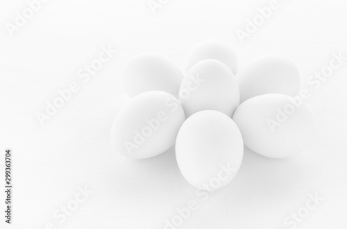 fresh white eggs on white background, closeup
