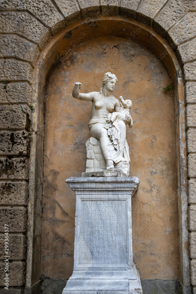 FLORENCE, TUSCANY/ITALY - OCTOBER 20 : Broken statue of a woman and her baby in Boboli Gardens Florence on October 20, 2019