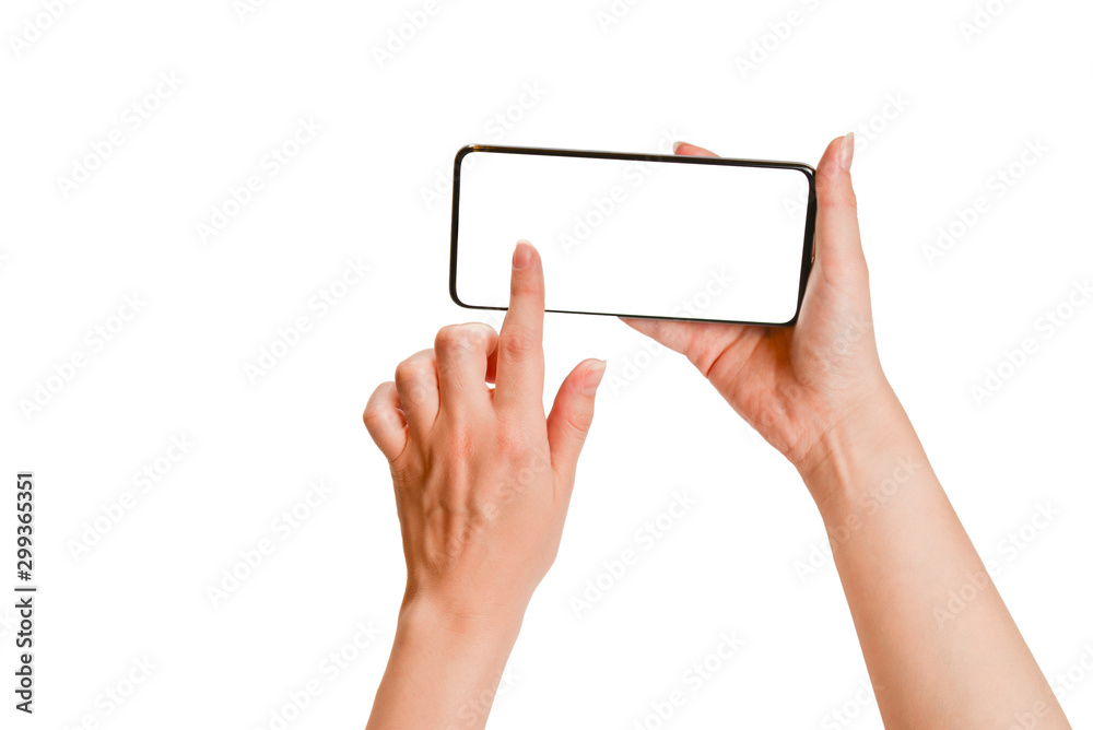 Smart phone in woman hands isolated on white background. White screen. Copy space. Smart phone in woman hands isolated on white background. White screen. Copy space.
