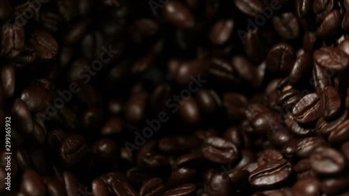 Super slow motion of rotating coffee beans in mill, speed ramping cut. Filmed on high speed cinema camera, 1000 fps. photo