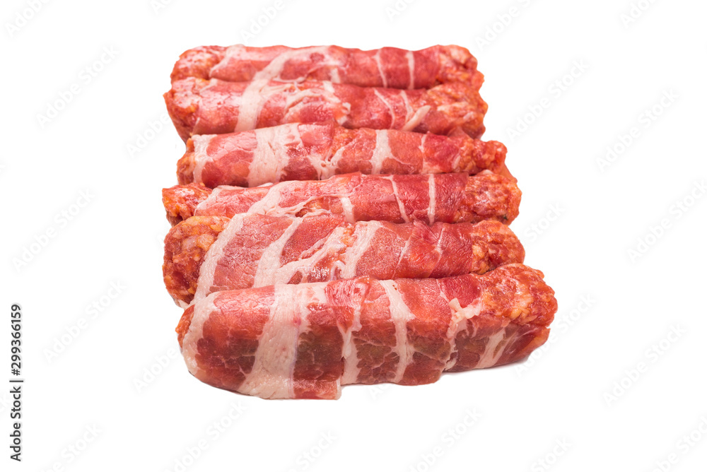 Chevapchichi in bacon isolated on white background. Chevapchichi in bacon isolated on white background.