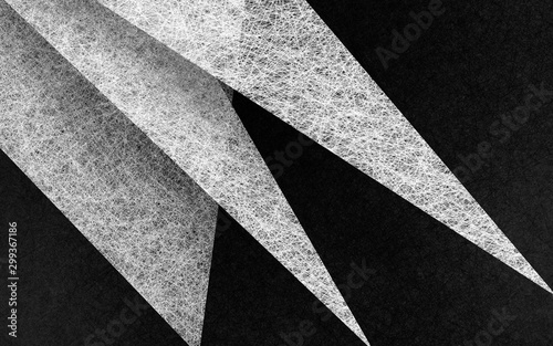 black and white abstract background with angled triangle shapes layered in abstract modern art style background pattern, textured background