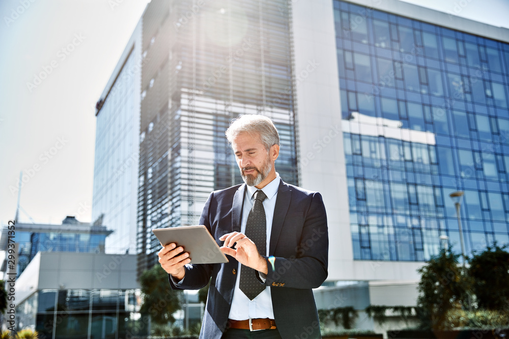senior businessman office building laptop tablet outdoor city senior businessman office building laptop tablet outdoor city