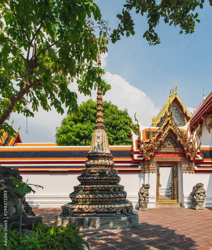 Classical Thai architecture of Wat Pho public temple, Bangkok, Thailand. Wat Pho known also as the Temple of the Reclining Buddha. Classical Thai architecture of Wat Pho public temple, Bangkok, Thailand. Wat Pho known also as the Temple of the Reclining Buddha.