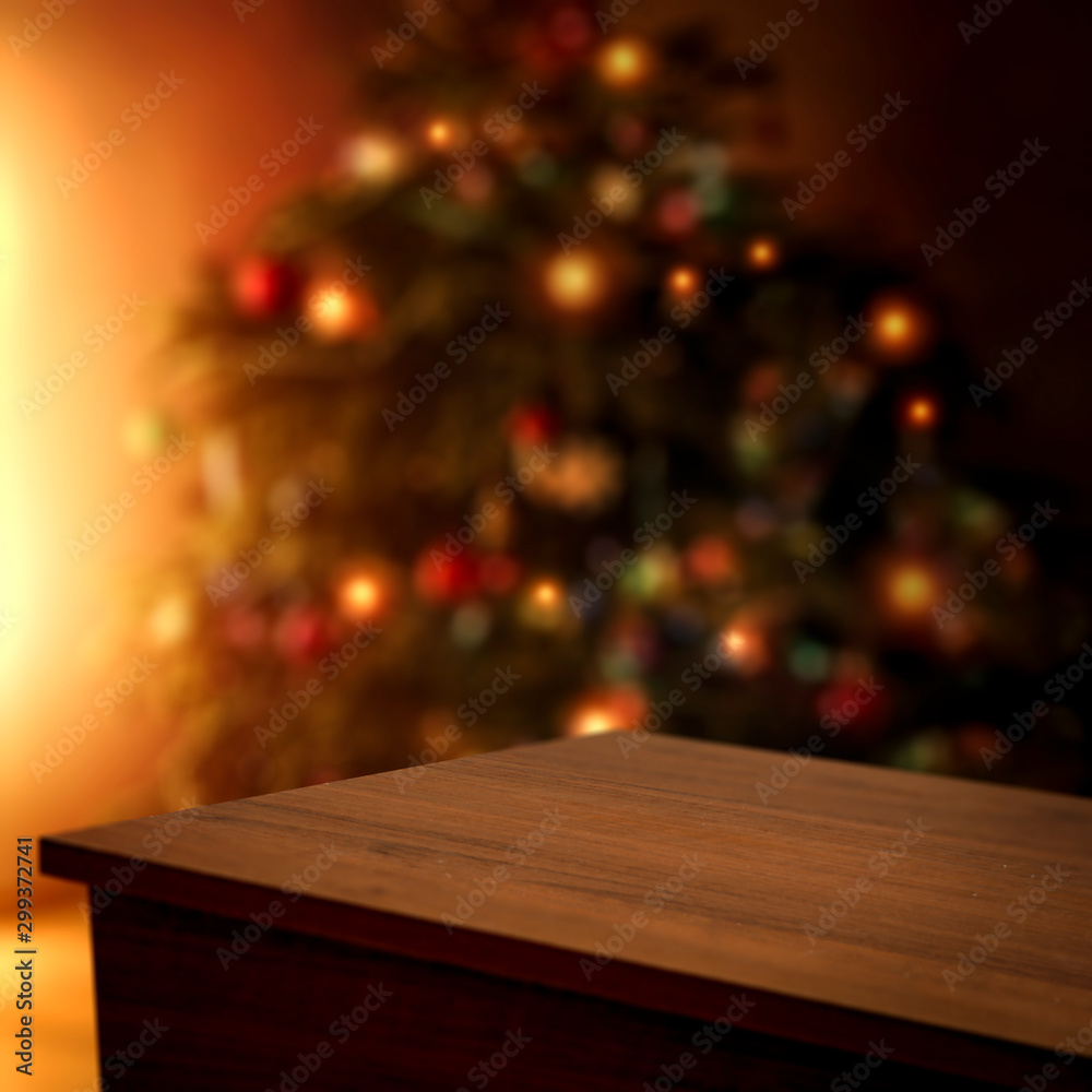 Wooden corner table of free space for your decoration and blurred christmas tree 