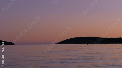 Enjoy a peaceful evening with a beautiful sunset at the croatian beach of Šibenik. A timelapse at the beach.