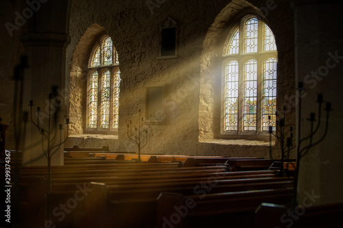 Stained glass windows with sun rays pouring in