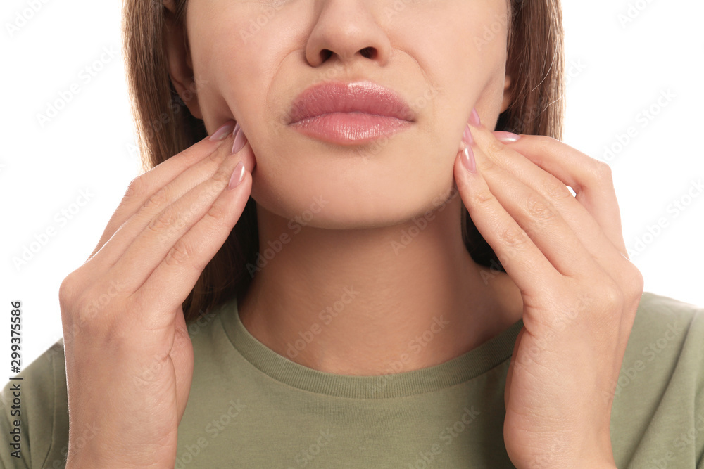 Young woman suffering from toothache on white background, closeup Young woman suffering from toothache on white background, closeup