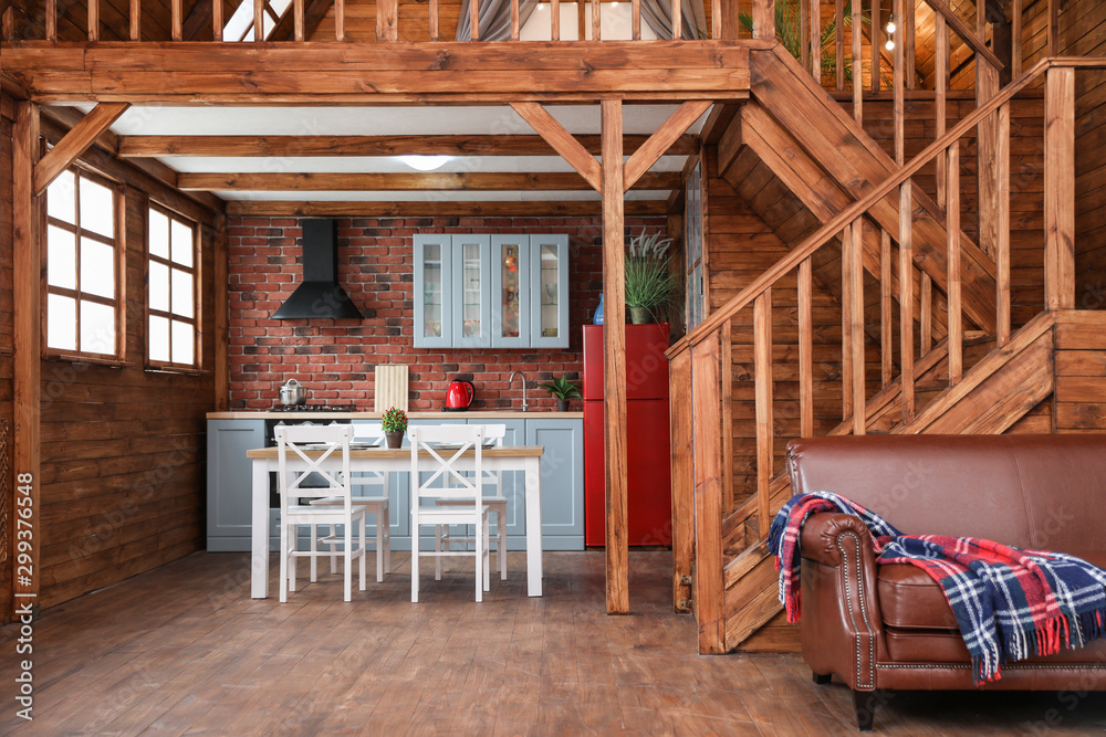 Stylish house interior with dining table, chairs and sofa Stylish house interior with dining table, chairs and sofa