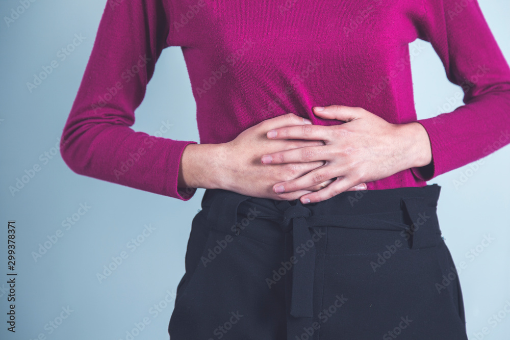 woman hand in ache stomach