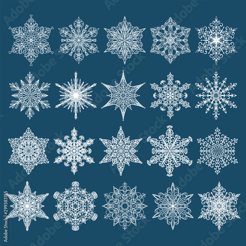 Collection of vector snowflakes. Set of twenty white winter icons on a blue background.