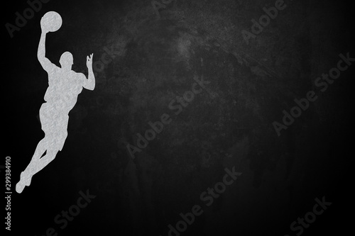 The basketball player has a black background and empty space