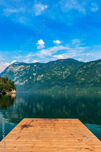 Wooden pier at Lake Bohinj in summer morning