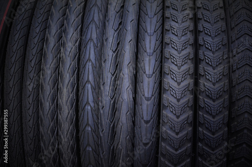 Bike tire in bike shop for sale - row of tyre with different patterns © Svetlana