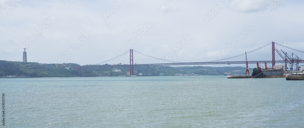 Panoramic view of the Ponte 25 de Abril bridge the river captured from the river promenade