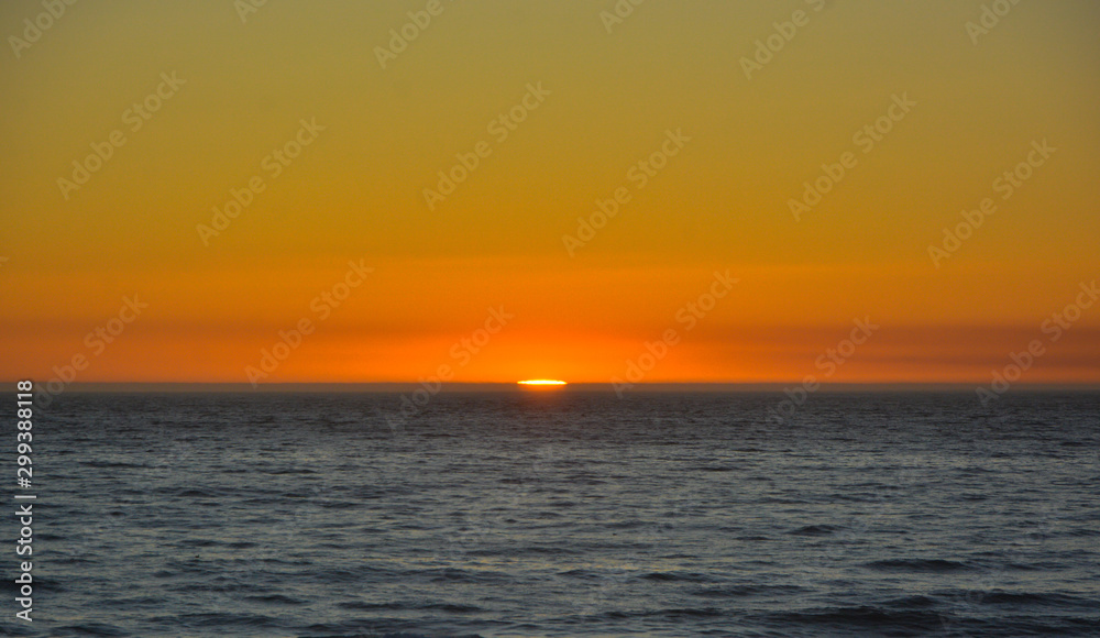Authentic sunset on the beach, sea and sun, space