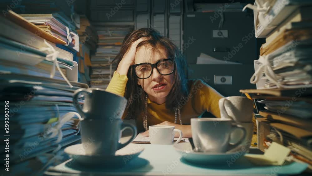 Exhausted stressed office worker having too many coffees