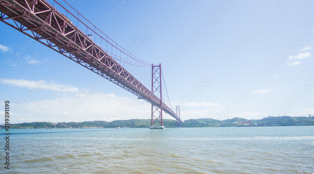 Stunning pictures of the Ponte 25 de Abril bridge - Over 2km-long, this striking Golden Gate-style bridge links Lisbon with Almada in Portugal. Stunning pictures of the Ponte 25 de Abril bridge - Over 2km-long, this striking Golden Gate-style bridge links Lisbon with Almada in Portugal.
