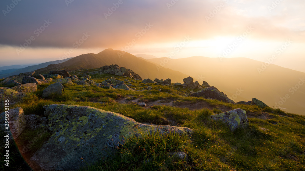 Sunset At Low Tatras, Setting Sun Shines Through Clouds Over The Mountain