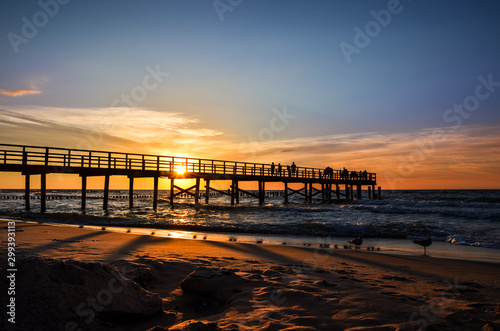 Pier at sunset over the Baltic Sea - Unie  cie  Poland.