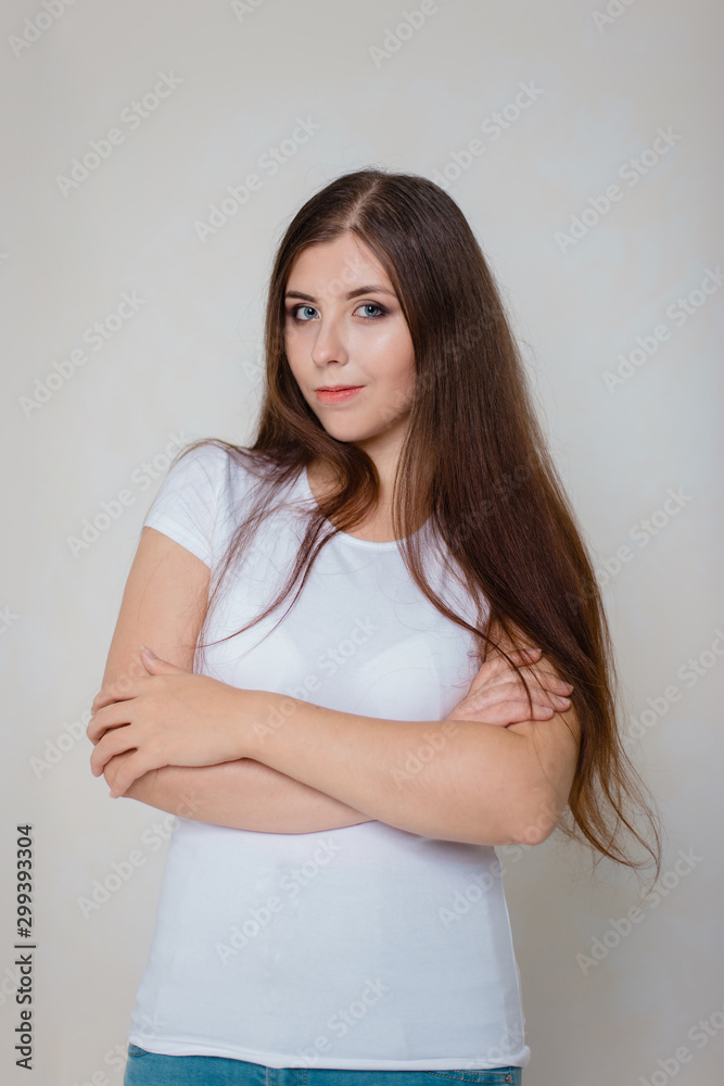 portrait of a young girl in a white t-shirt on a white background portrait of a young girl in a white t-shirt on a white background