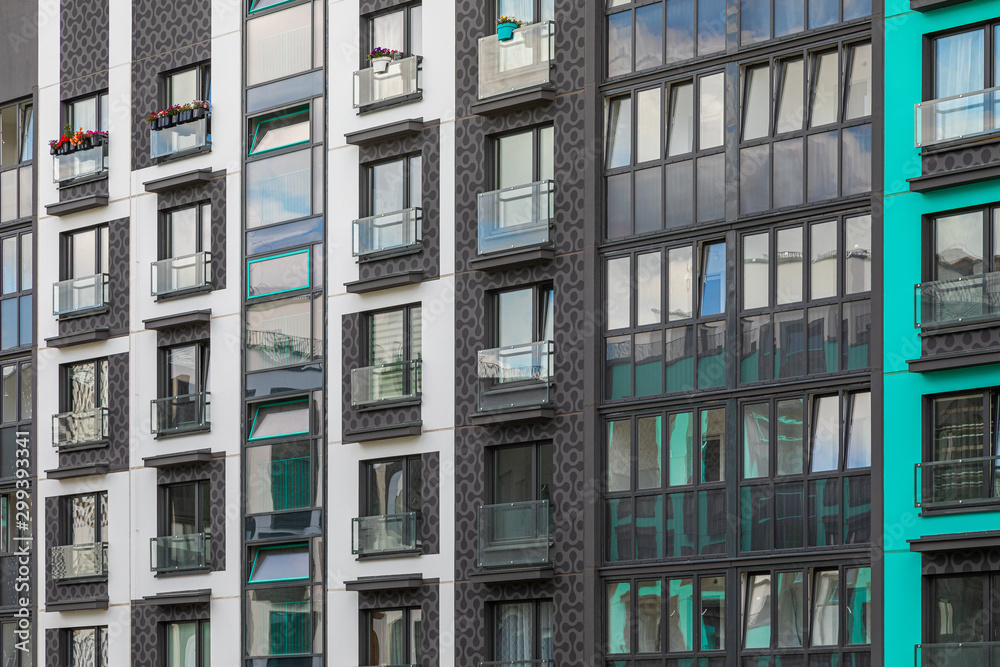 Fototapeta premium Angular view of new apartment building wall