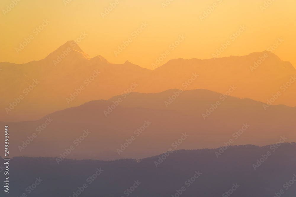 The morning light hits the scenic Himalayan mountains in the Indian town of Kausani in Kumaon, Uttarakhand.