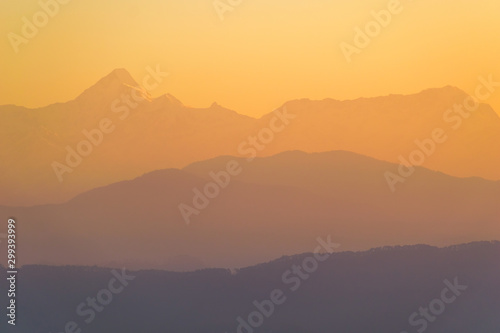 The morning light hits the scenic Himalayan mountains in the Indian town of Kausani in Kumaon, Uttarakhand.
