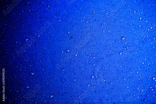 Water drops on the blue fabric.water drops on blue background