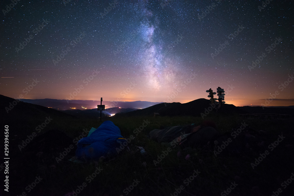 Sleeping Under The Stars, Men In A Sleeping Bag And Shining Milky Way Above Their Heads, Million Stars Hotel