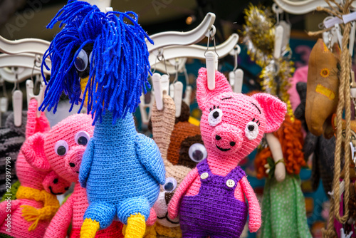 Different decoration, toy for xmas tree on christmas market, close up of cozy handmade toys © pahis