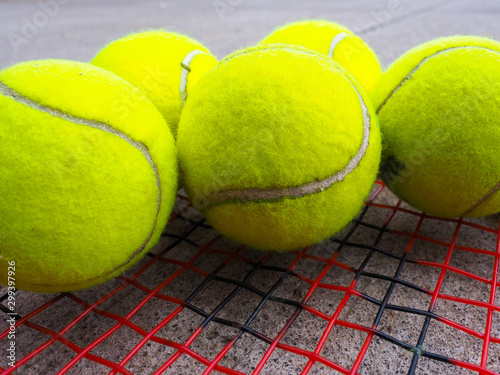 tennis balls on racket © Ronda