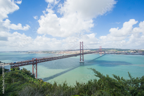 Fototapeta Naklejka Na Ścianę i Meble -  Stunning pictures of the Ponte 25 de Abril bridge - Over 2km-long, this striking Golden Gate-style bridge links Lisbon with Almada in Portugal. 