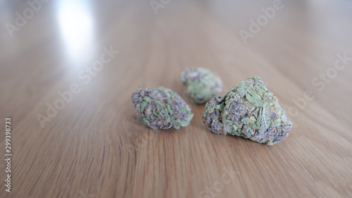 Cannabis Marijuana Buds on Wood Table - Purple Power Plant Strain