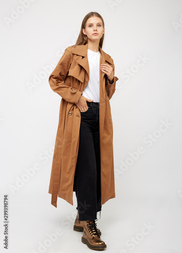 Female trench coat camel color isolated on white background. photo