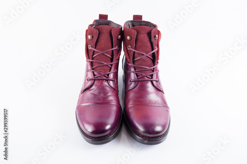 Pair of male red leather boots on white background, isolated product, top view.