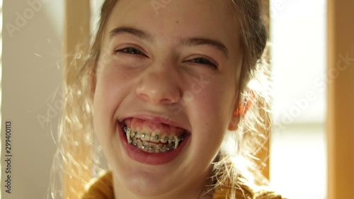 Bored Authentic, Blue Eyed, Blond Haired, Teenage Girl Yawning And Laughing, Backlit, Close Up Head Shot.