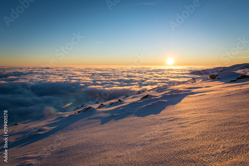 Sunset above the clouds. Winter inversion in National Park Low Tatras, Slovakia.