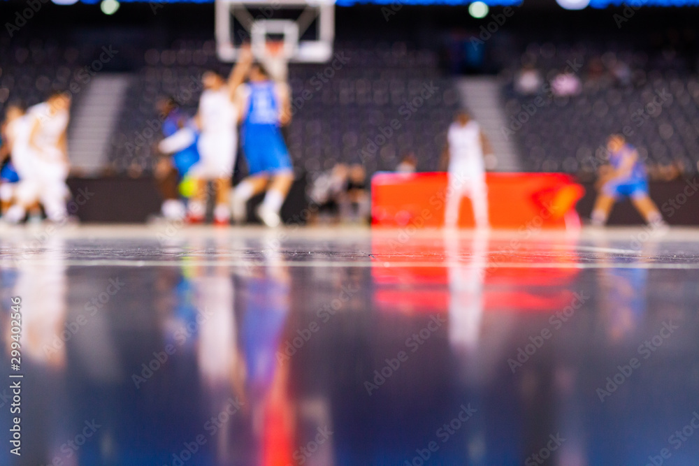 blurred background of basketball players on court during game very