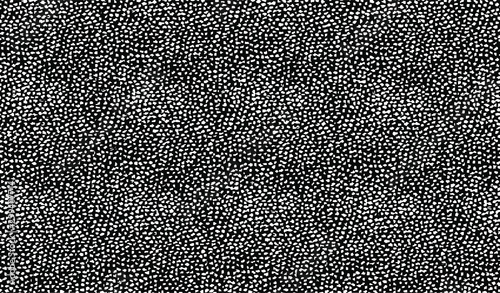 Small uneven spots and particles of debris. Abstract vector texture.  Distressed uneven background. Grunge texture overlay with fine grains isolated on white background. Vector illustration. EPS10.