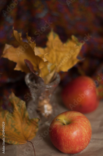 autumn still life with apples and leaves
