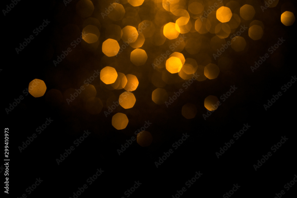 Golden abstract bokeh on black background. Holiday concept. Golden abstract bokeh on black background. Holiday concept.