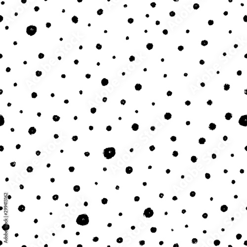 Seamless pattern of polka dots of different sizes. Vector photo