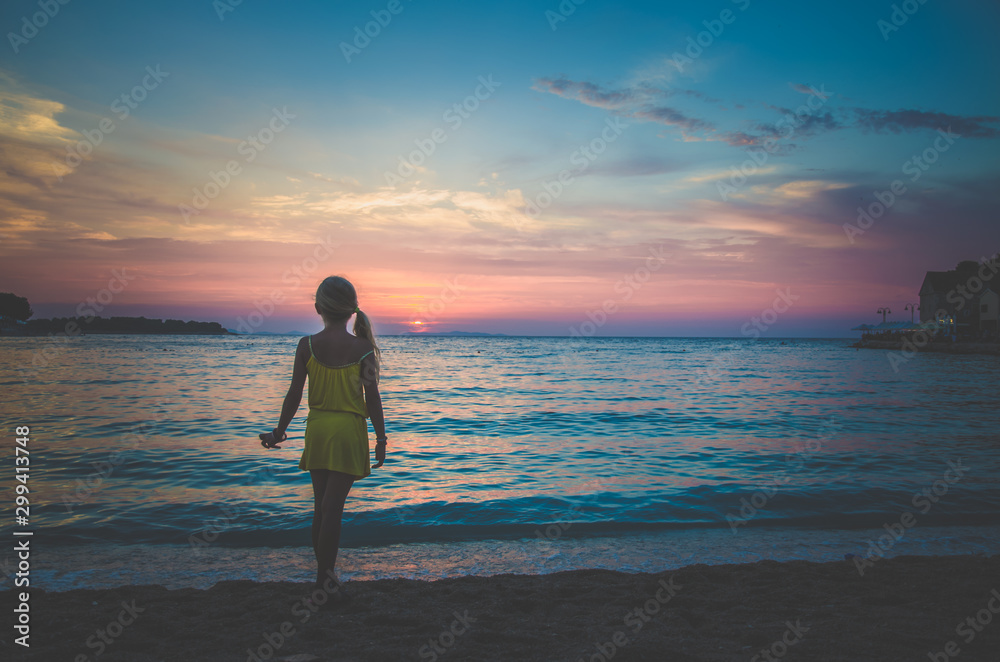 child, sea and colorful pink blue sunset