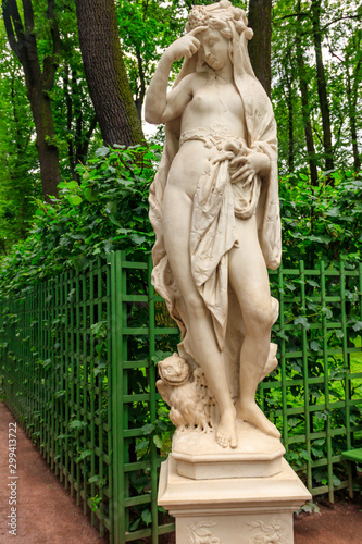 Marble statue Allegory of Night in old city park Summer Garden in St. Petersburg, Russia © olyasolodenko