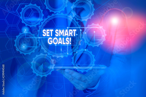 Conceptual hand writing showing Set Smart Goals. Concept meaning list to clarify your ideas focus efforts use time wisely Picture photo network scheme with modern smart device