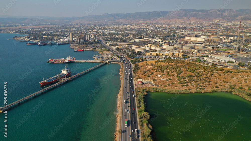 Obraz premium Aerial drone photo of industrial refinery of Hellenic Public Petroleum company in gulf of Aspropirgos, Attica, Greece